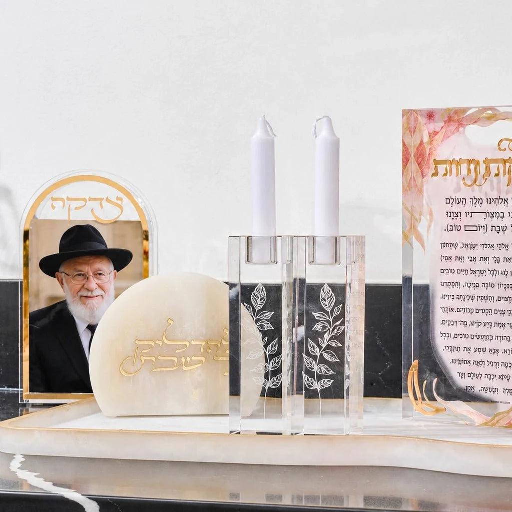 Waterdale Shabbos Judaica display with Lucite candlesticks and Hebrew decor