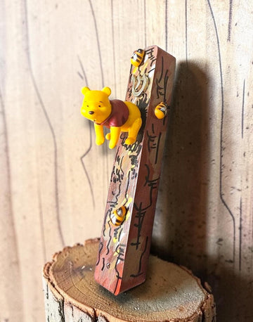 Winnie the Pooh mezuzah with bear and wooden bees on painted tree