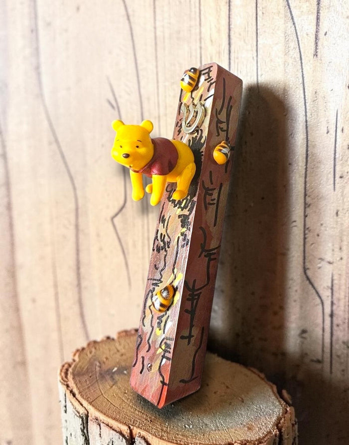 Winnie the Pooh mezuzah with bear and wooden bees on painted tree