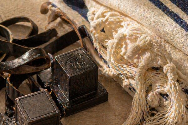 Tefillin and siddur on a velvet cloth